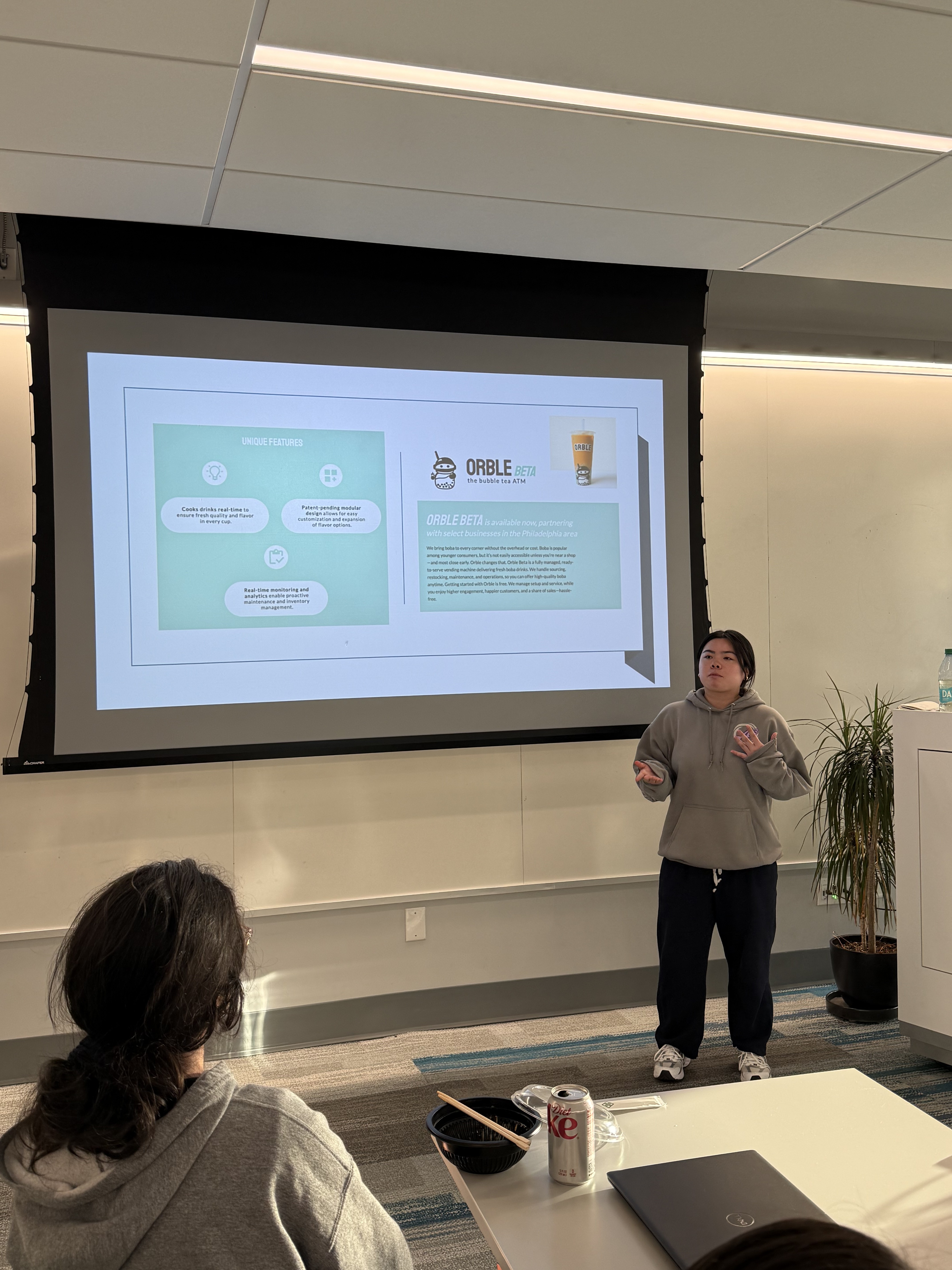 An analyst presenting project work to the org